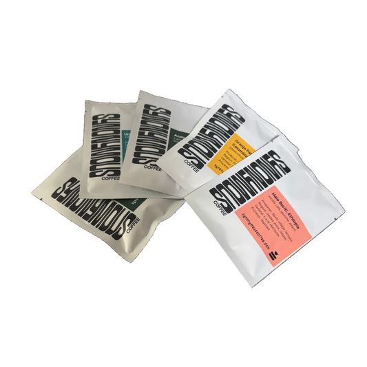 Three coffee packets from synonymous Coffee on a white background